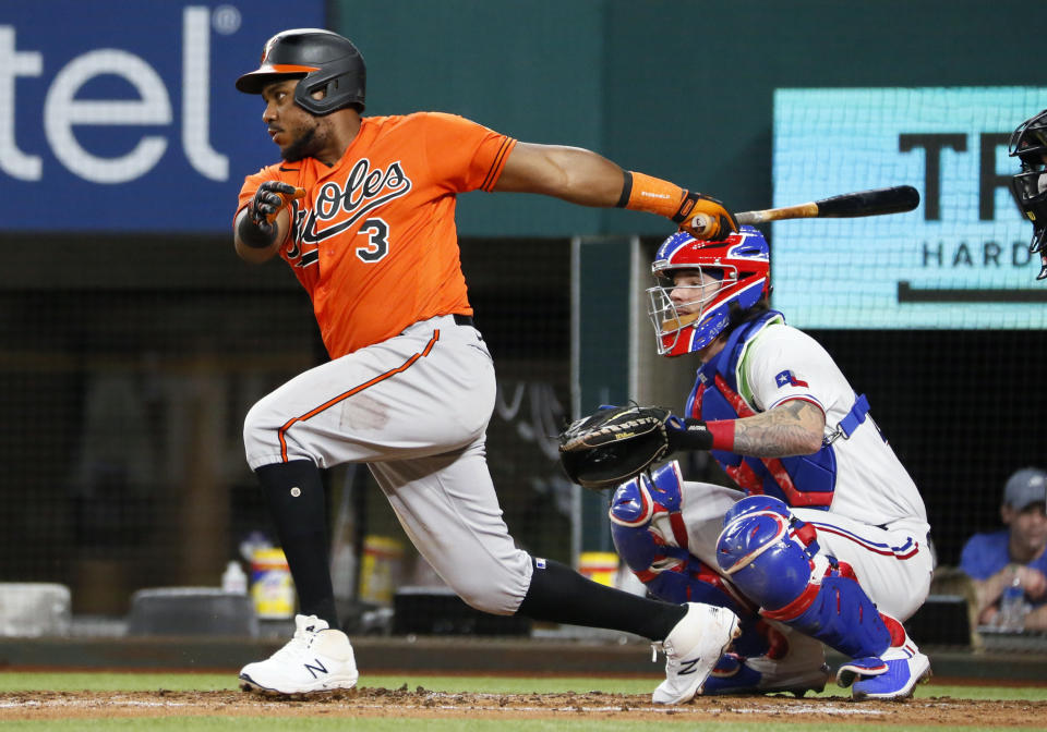 Baltimore Orioles' Maikel Franco follows thru on a base hit against the Texas Rangers during the fifth inning of a baseball game in Arlington, Texas, Saturday, April 17, 2021. (AP Photo/Ray Carlin)