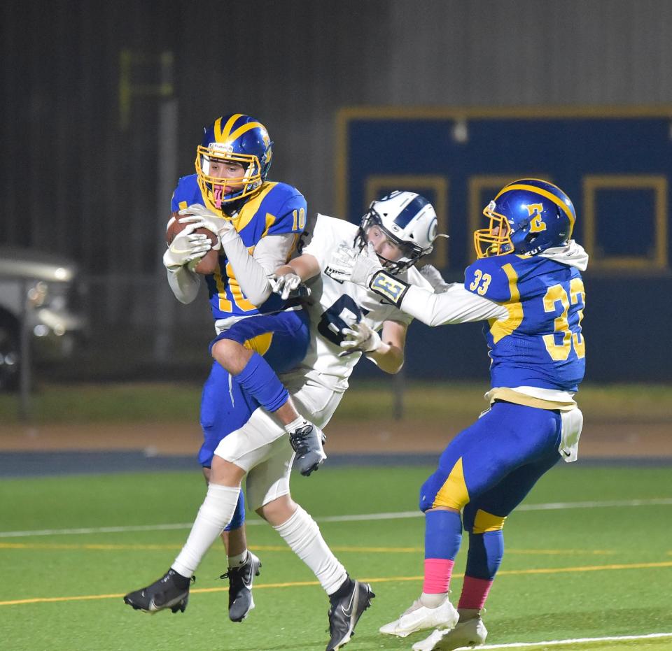 Exeter High SchoolÕs Ruben Ruiz gets an interception against Central Valley ChristianÕs Chapman Dunn in a Central Sequoia League football game Friday, October 29, 2021. 