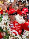 FILE PHOTO: New Zealand's Scott Dixon of the Target Chip Ganassi IRL team celebrates after winning the 92nd Indianapolis 500. Vitor Meira finished second and Marco Andretti third, while Danica Patrick was knocked out of the race in a pit lane crash.