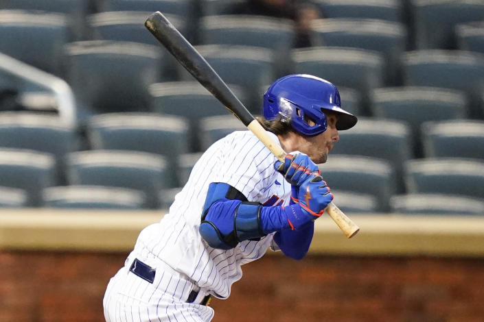 New York Mets' Jeff McNeil follows through on a single during the third inning in the first baseball game of a doubleheader against the Washington Nationals, Tuesday, Oct. 4, 2022, in New York. The Mets won 4-2. (AP Photo/Frank Franklin II)