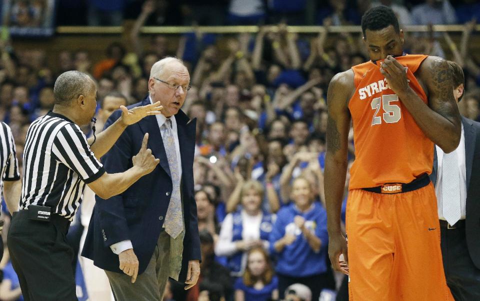 Syracuse coach Jim Boeheim is called for a technical foul by an official as Rakeem Christmas (25) walks away during the second half of an NCAA college basketball game against Duke in Durham, N.C., Saturday, Feb. 22, 2014. Duke won 66-60. (AP Photo/Gerry Broome)