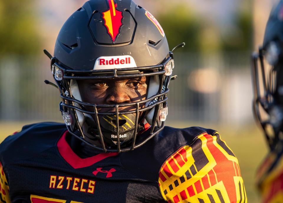 Palm Desert's Bryce Boulton (60) looks to a teammate while warming up before their game at Palm Desert High School in Palm Desert, Calif., Friday, Aug. 26, 2022. 