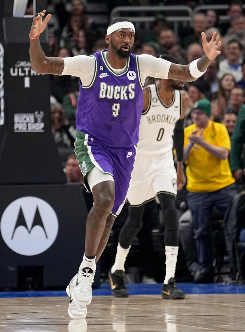 Bucks forward Bobby Portis heads back on defense after canning a three-pointer against the Nets during the first half Thursday night at Fiserv Forum.