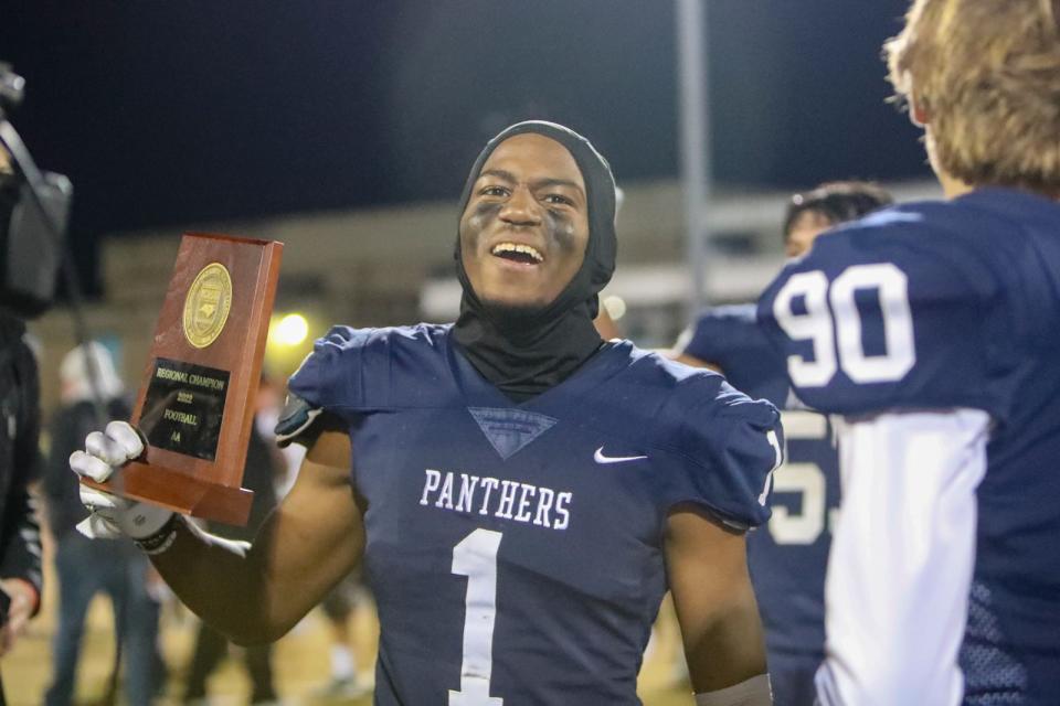 East Duplin's Daunte Hall celebrates the Panthers' regional title Friday night.