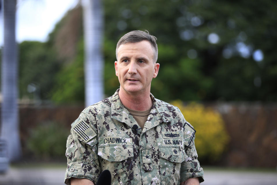 U.S. Navy Rear Adm. Robb Chadwick speaks to the media at the main gate at Joint Base Pearl Harbor-Hickam, Wednesday, Dec. 4, 2019, in Hawaii, following a shooting. (AP Photo/Marco Garcia)