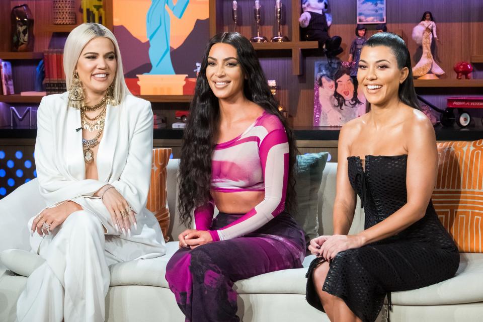 Khloe, Kim, and Kourtney Kardashian at an event