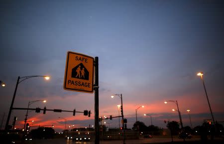 A sign marking the Safe Passage route is seen at an intersection in the Englewood neighborhood in Chicago, Illinois, United States, September 8, 2015. REUTERS/Jim Young