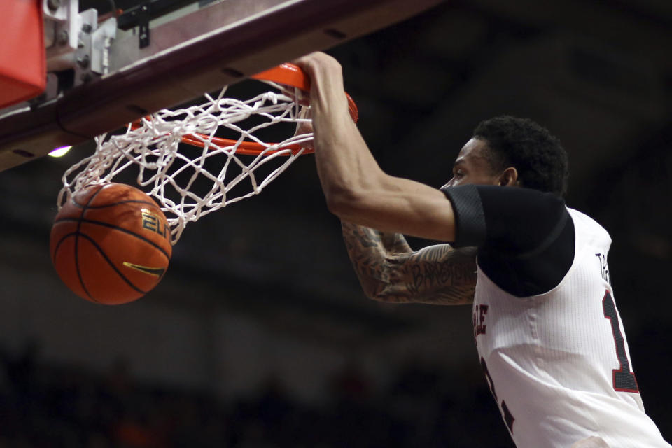 Louisville's JJ Traynor scores against Virginia Tech in the first half of an NCAA college basketball game in Blacksburg, Va., Sunday, Dec. 3, 2023. (Matt Gentry/The Roanoke Times via AP)