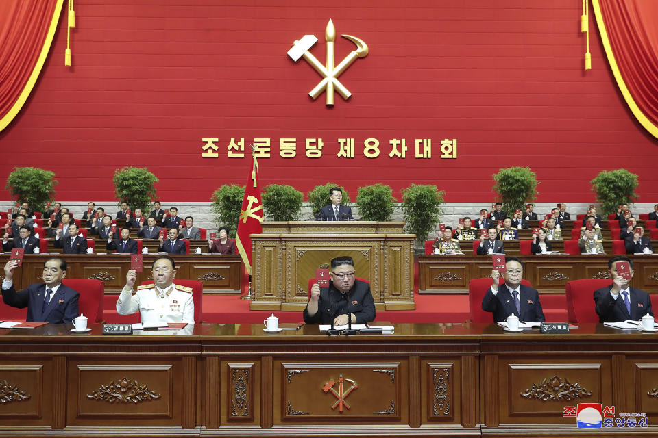 In this photo provided by the North Korean government, North Korean leader Kim Jong Un, center, attends a ruling party congress in Pyongyang, North Korea Tuesday, Jan. 5, 2021. Kim opened its first Workers’ Party Congress in five years with an admission of policy failures and a vow to lay out new developmental goals, state media reported Wednesday. Independent journalists were not given access to cover the event depicted in this image distributed by the North Korean government. The content of this image is as provided and cannot be independently verified. Korean language watermark on image as provided by source reads: "KCNA" which is the abbreviation for Korean Central News Agency. (Korean Central News Agency/Korea News Service via AP)