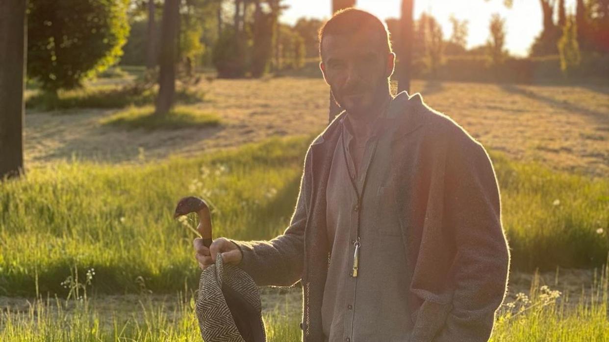 David Beckham pictured walking near his home in the country