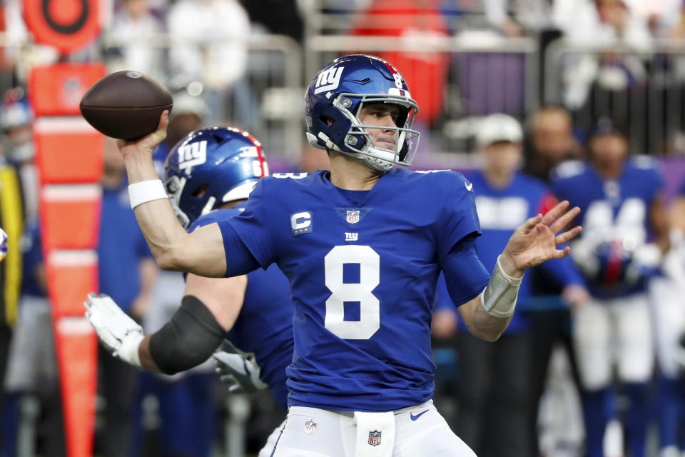 New York Giants quarterback Daniel Jones (8) throws a pass during the first half of an NFL football game against the Minnesota Vikings, Saturday, Dec. 24, 2022, in Minneapolis. (AP Photo/Bruce Kluckhohn)