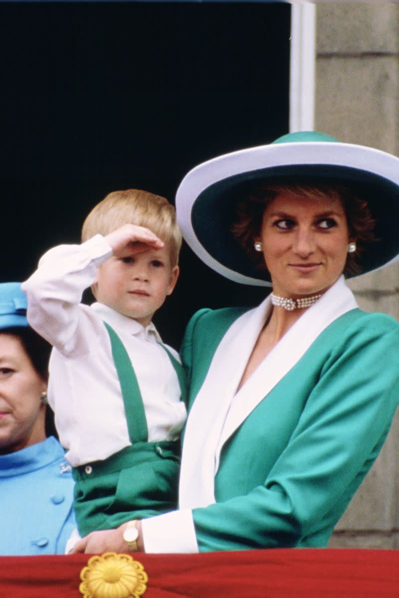 <p> Coordinating her white-and-green outfit with Prince Harry at the Royal Trooping the Colour in 1988. The mother and son were with the royal family on the balcony of Buckingham Palace. </p>
