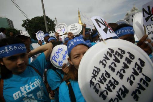 Demonstrators including ethnic Kachins, artists and civil society groups, walk through downtown Yangon. Several hundred people have marched through Yangon calling for an end to the festering conflict between Kachin ethnic minority rebels and Myanmar's army