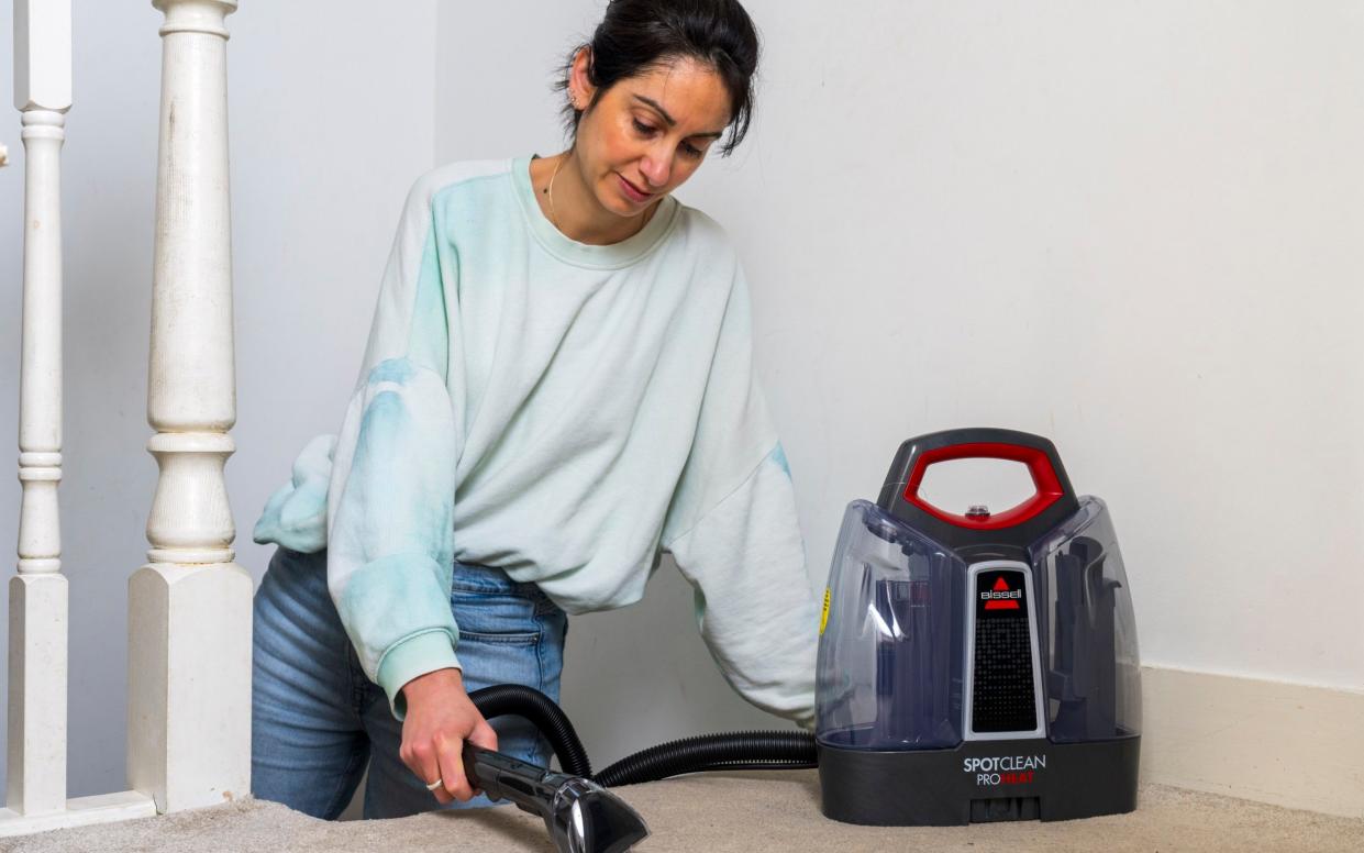 'I finally understand the life-changing magic of getting out damned spots': Silverman using the Bissell SpotClean on her carpet