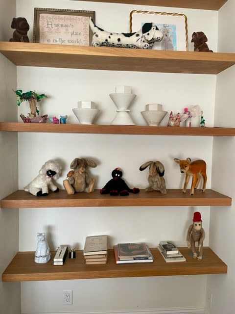 Stephanie Savage’s collection of Truman Capote stuffed animals are placed together on a shelf alongside other tchotchkes.