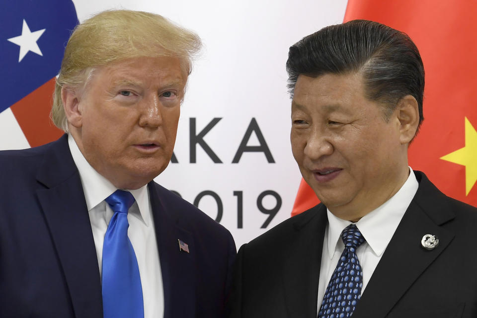 FILE - In this June 29, 2019, file photo, U.S. President Donald Trump poses for a photo with Chinese President Xi Jinping during a meeting on the sidelines of the G-20 summit in Osaka, western Japan. Chinese leaders hope Washington will tone down conflicts over trade, technology and security if Joe Biden wins the Nov. 3 presidential election. But any shift is likely to be in style, not substance, as frustration with Beijing increases across the American political spectrum. (AP Photo/Susan Walsh, File)