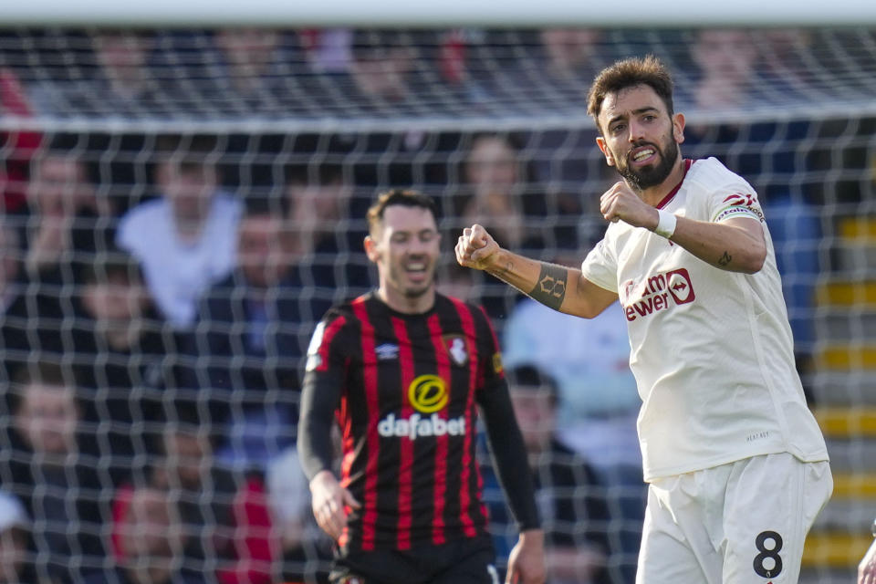 Manchester United's Bruno Fernandes celebrates after scoring his side's opening goal during the English Premier League soccer match between Bournemouth and Manchester United, at The Vitality Stadium in Bournemouth, England, Saturday, April 13, 2024. (AP Photo/Kirsty Wigglesworth)