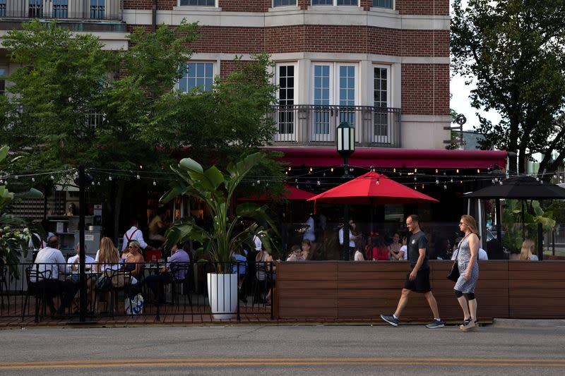 People go out to eat at crowded restaurants in Birmingham, Michigan