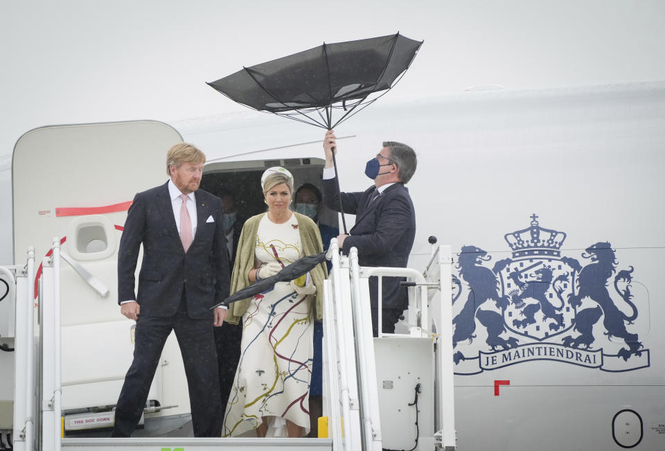 King Willem-Alexander of the Netherlands and Queen Maxima arrive at the Brandenburg Airport in Berlin, Germany, Monday, July 5, 2021. The Royals arrived in Germany for a three-day visit that was delayed from last year because of the coronavirus pandemic. (Kay Nietfeld/dpa via AP)