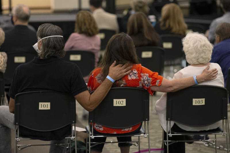 Sandy James (centre) accompanied by her husband, Brian, (left) and mother, Dolly Kreis (right) attend a court appearance by Joseph James DeAngelo in Sacramento.