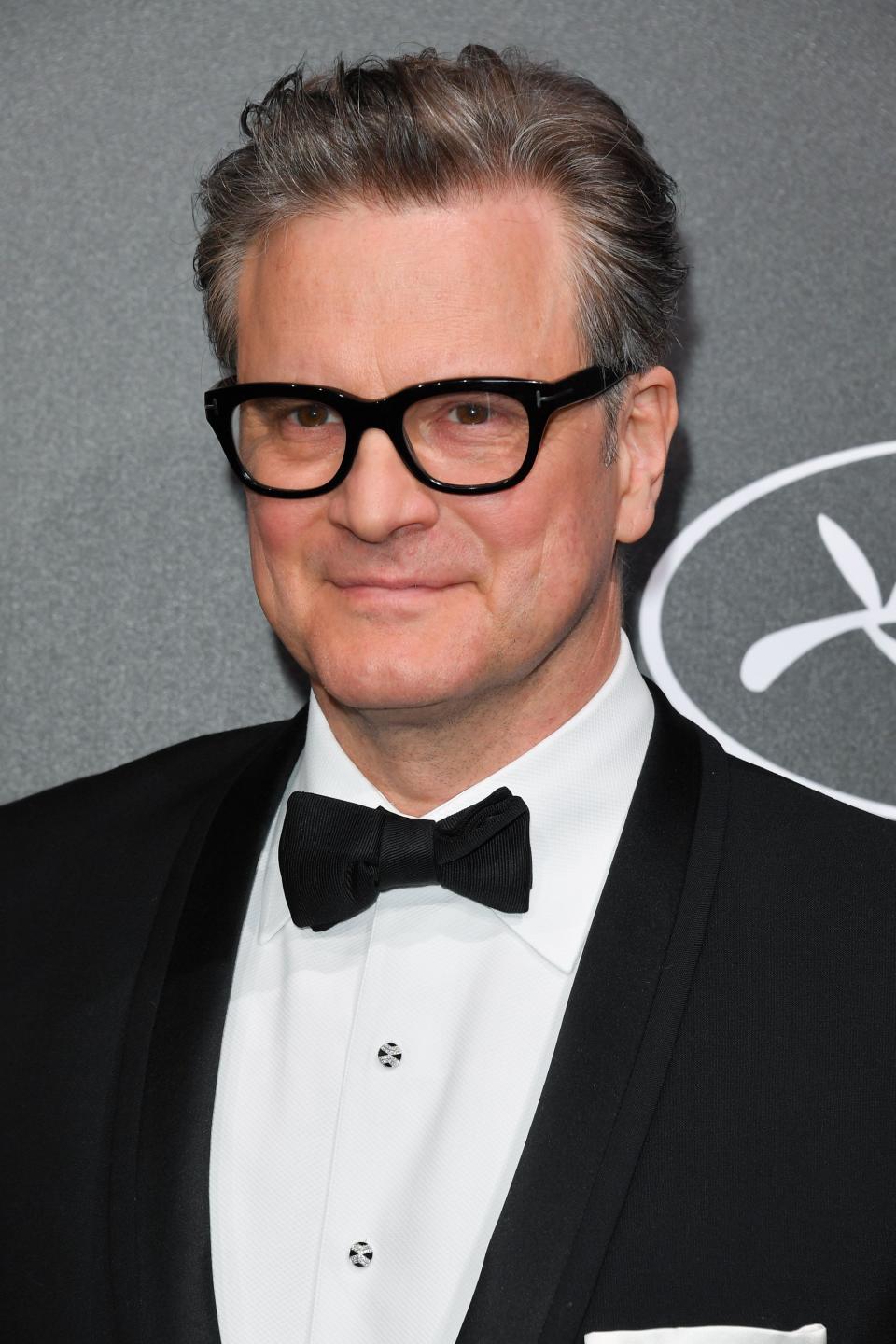 Looking fabulous as ever, Colin Firth stuns in black suit and pant with a white inner-wear