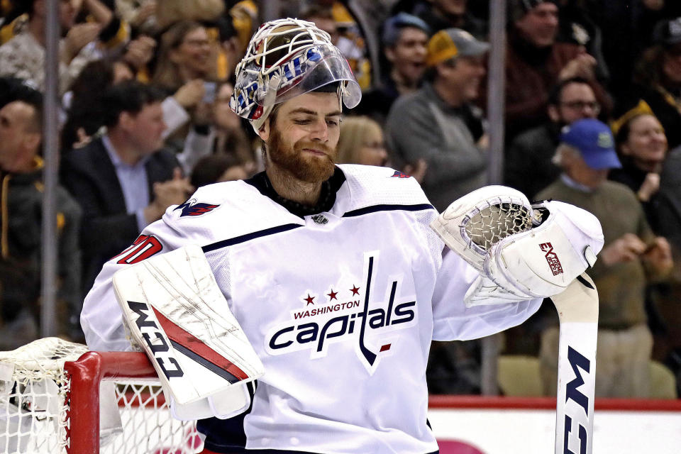 Washington Capitals goaltender Braden Holtby collects himself after allowing a goal by Pittsburgh Penguins' Sidney Crosby in the second period of an NHL hockey game in Pittsburgh, Tuesday, March 12, 2019. The Penguins won 5-3. (AP Photo/Gene J. Puskar)