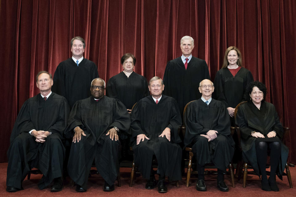 FILE - Members of the Supreme Court pose for a group photo at the Supreme Court in Washington, April 23, 2021. Seated from left are Associate Justice Samuel Alito, Associate Justice Clarence Thomas, Chief Justice John Roberts, Associate Justice Stephen Breyer and Associate Justice Sonia Sotomayor, Standing from left are Associate Justice Brett Kavanaugh, Associate Justice Elena Kagan, Associate Justice Neil Gorsuch and Associate Justice Amy Coney Barrett. Beyer, Sotomayor and Kagan dissenting comment to the court's opinion that overturned Roe v. Wade, "The Court reverses course today for one reason and one reason only: because the composition of this Court has changed," was listed at number four on a Yale Law School librarian's list of the most notable quotations of 2022. (Erin Schaff/The New York Times via AP, Pool, File)