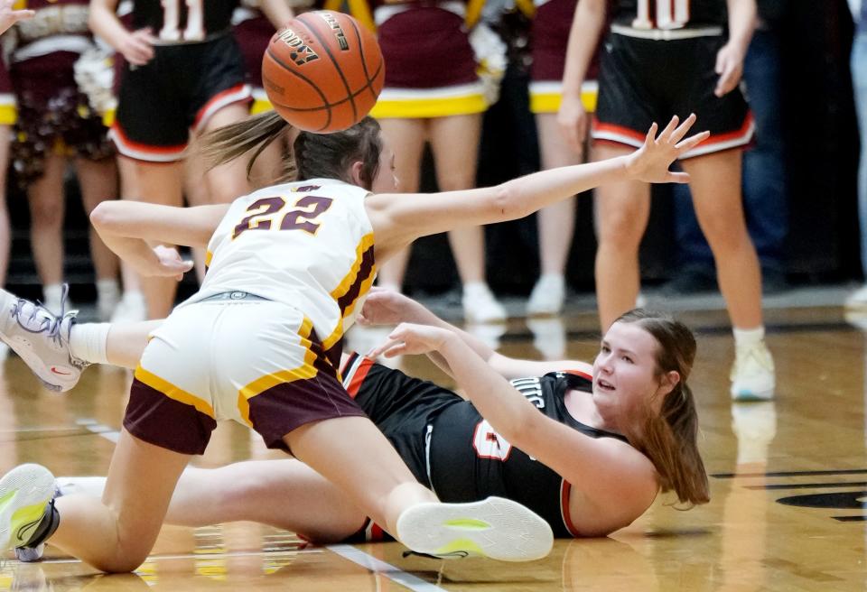 Viborg-Hurley's Shelby Lyons passes the ball from the floor against Ethan's Ella Pollreisz (22) during their semifinal game in the state Class B high school girls basketball tournament on Friday, March 10, 2023 in the Huron Arena.