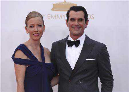 Actor Ty Burrell, from the ABC sitcom "Modern Family," and his wife Holly arrive at the 65th Primetime Emmy Awards in Los Angeles September 22, 2013. REUTERS/Mario Anzuoni (UNITED STATES - Tags: ENTERTAINMENT) (EMMYS-ARRIVALS)