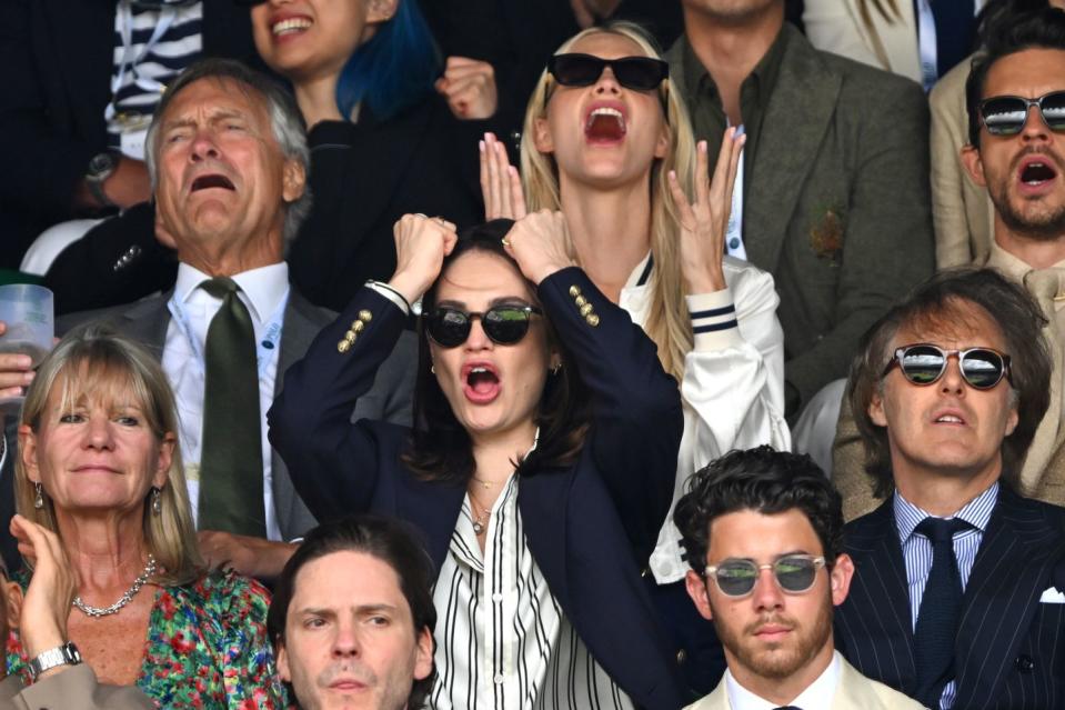 london, england july 16 lily james and poppy delevingne watch carlos alcaraz vs novak djokovic in the wimbledon 2023 mens final on centre court during day fourteen of the wimbledon tennis championships at the all england lawn tennis and croquet club on july 16, 2023 in london, england photo by karwai tangwireimage