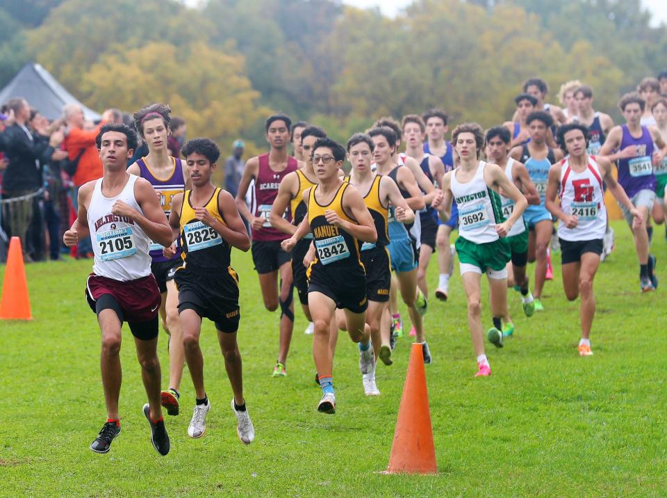 From left, ArlingtonÕs Ethan Green leads the pack on his way to winning the Boys Varsity II race in the Section 1 Coaches Cross-Country Invitational at Bowdoin Park in Wappingers Falls Oct. 21, 2023.