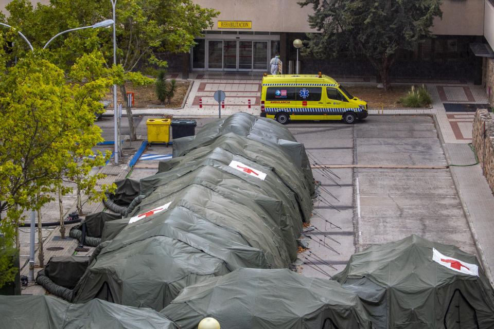 Spanish military tents are set out to be used by hospital patients during the coronavirus outbreak at the Gomez Ulla military hospital in Madrid, Spain, Friday, Sept. 18, 2020. A line of green tents have been installed at the gates of a Madrid military hospital four months after similar structures for triaging incoming patients and lighten up crammed emergency wards were taken down. (AP Photo/Manu Fernandez)