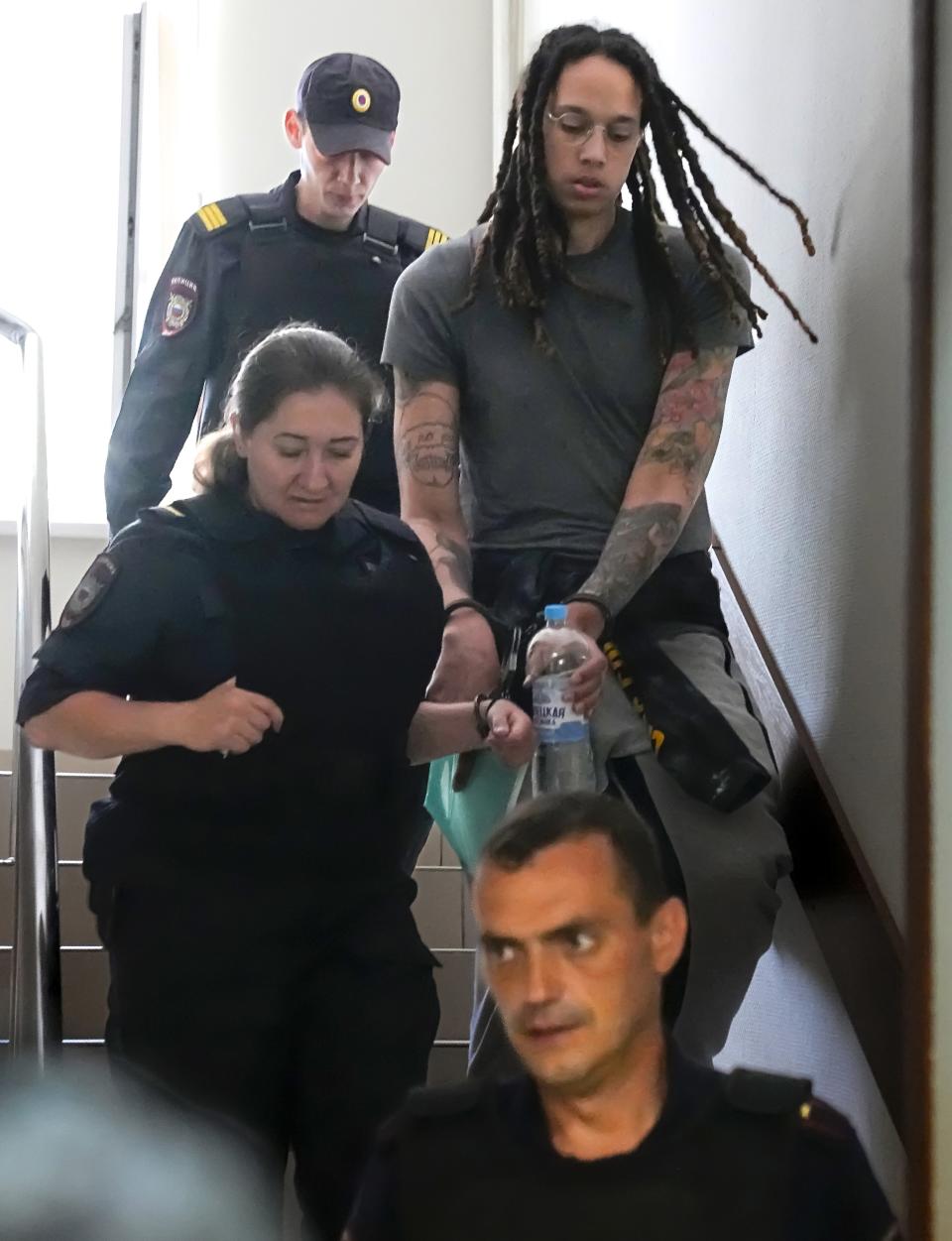 Brittney Griner is escorted to a courtroom for a hearing in Khimki just outside Moscow, Russia, Monday, June 27, 2022.