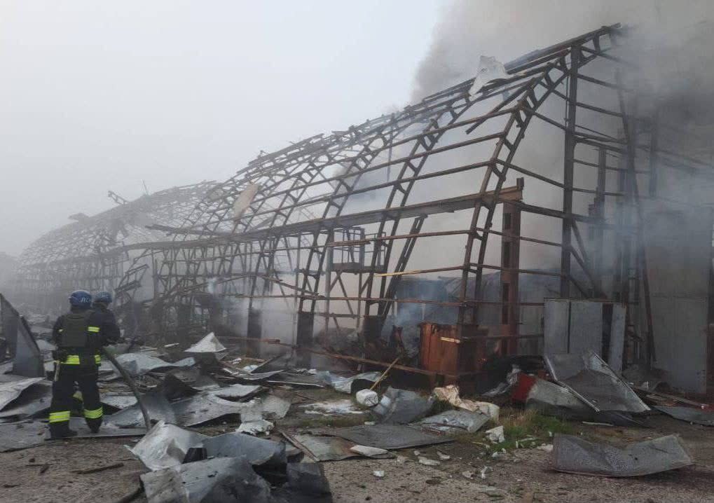 Firefighters work at a facility of a transport company damaged by a Russian missile strike in Dnipro (via REUTERS)