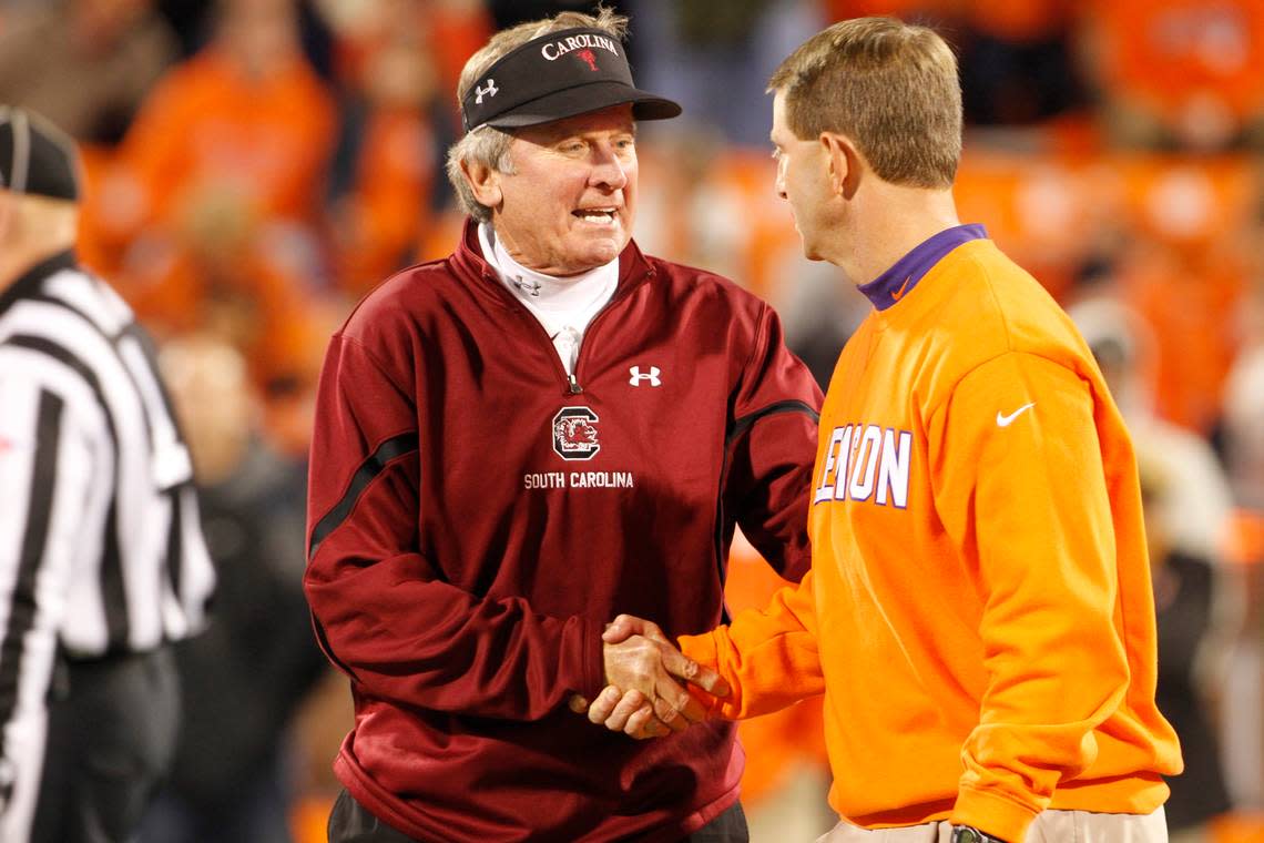 South Carolina head coach Steve Spurrier and Clemson head coach Dabo Swinney shake hands and chat prior to their game at Memorial Stadium in Clemson, SC.