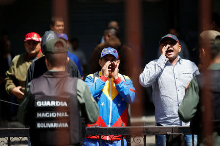 Government supporters shout while standing outside the National Assembly, in Caracas, Venezuela July 5, 2017. REUTERS/Andres Martinez Casares