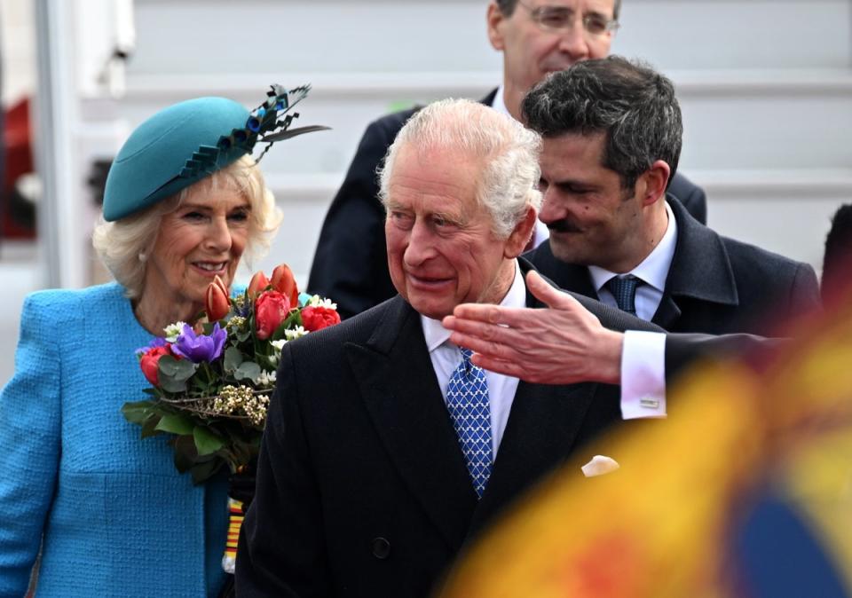 Charles and Camilla are greeted a the airport (EPA)
