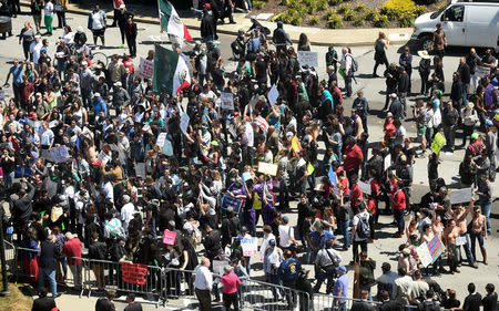 Demonstrators against U.S. Republican presidential candidate Donald Trump gather outside the Hyatt hotel where Trump is set to speak at the California GOP convention in Burlingame, California April 29, 2016. REUTERS/Noah Berger