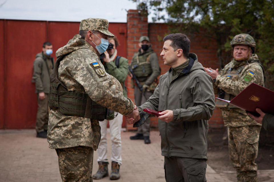 Image: Zelensky shakes hands with a serviceman in the Ukrainian town of Zolote last week (Ukrainian Presidential Press Service / AFP - Getty Images)