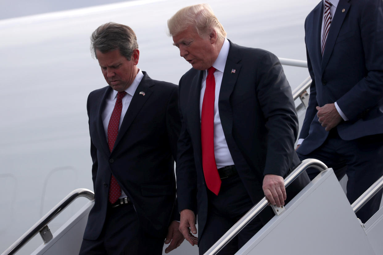 U.S. President Donald Trump and republican candidate for Georgia governor Brian Kemp arrive to attend a campaign rally at Middle Georgia Regional Airport in Macon, Georgia, U.S., November 4, 2018. REUTERS/Jonathan Ernst