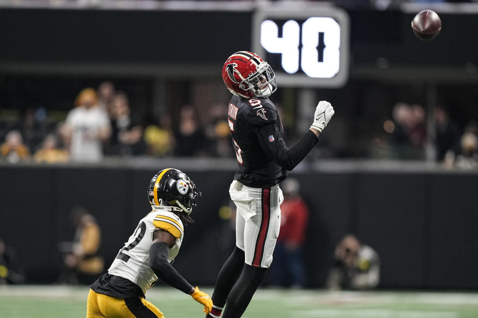 Atlanta Falcons wide receiver Drake London (5) misses a pass against Pittsburgh Steelers cornerback James Pierre (42) during the first half of an NFL football game, Sunday, Dec. 4, 2022, in Atlanta. (AP Photo/Brynn Anderson)