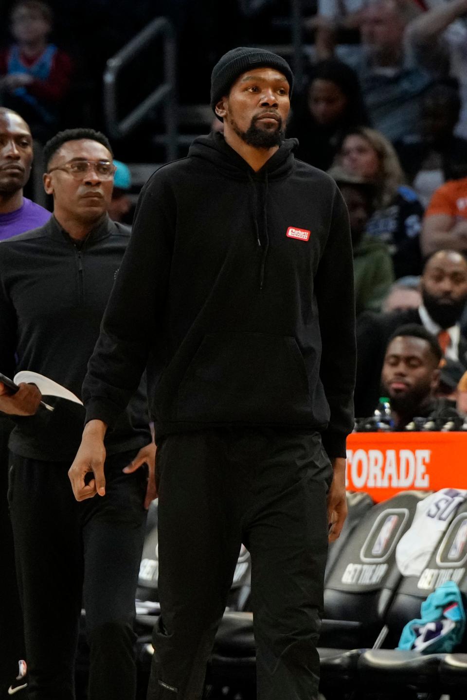 Suns forward Kevin Durant watches Friday's game against the Thunder from the sideline.