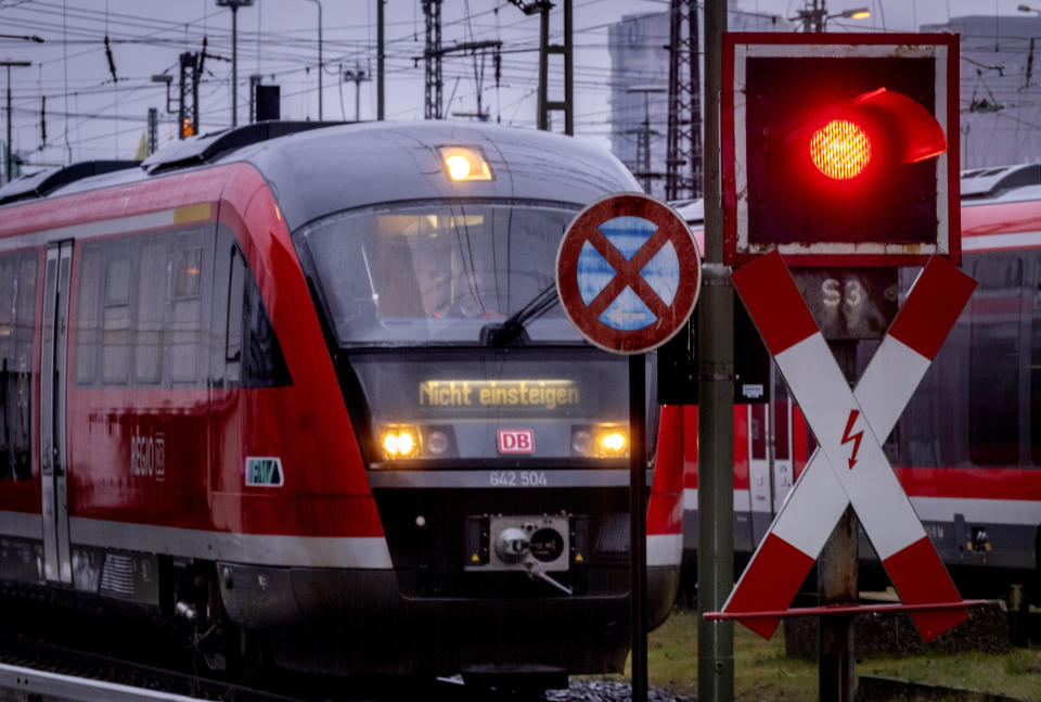 A train waits at a red traffic light outside the central train station in Frankfurt, Germany, Monday, March 11, 2024. German train drivers union GDL called for another strike starting early Tuesday. (AP Photo/Michael Probst)