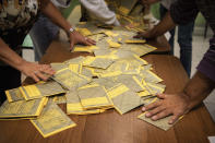 Papers ballots are counted in a polling station in Turin, northern Italy, Sunday, Sept. 25, 2022. Italians voted in a national election that might yield the nation's first government led by the far right since the end of World War II. (Marco Alpozzi/LaPresse via AP)