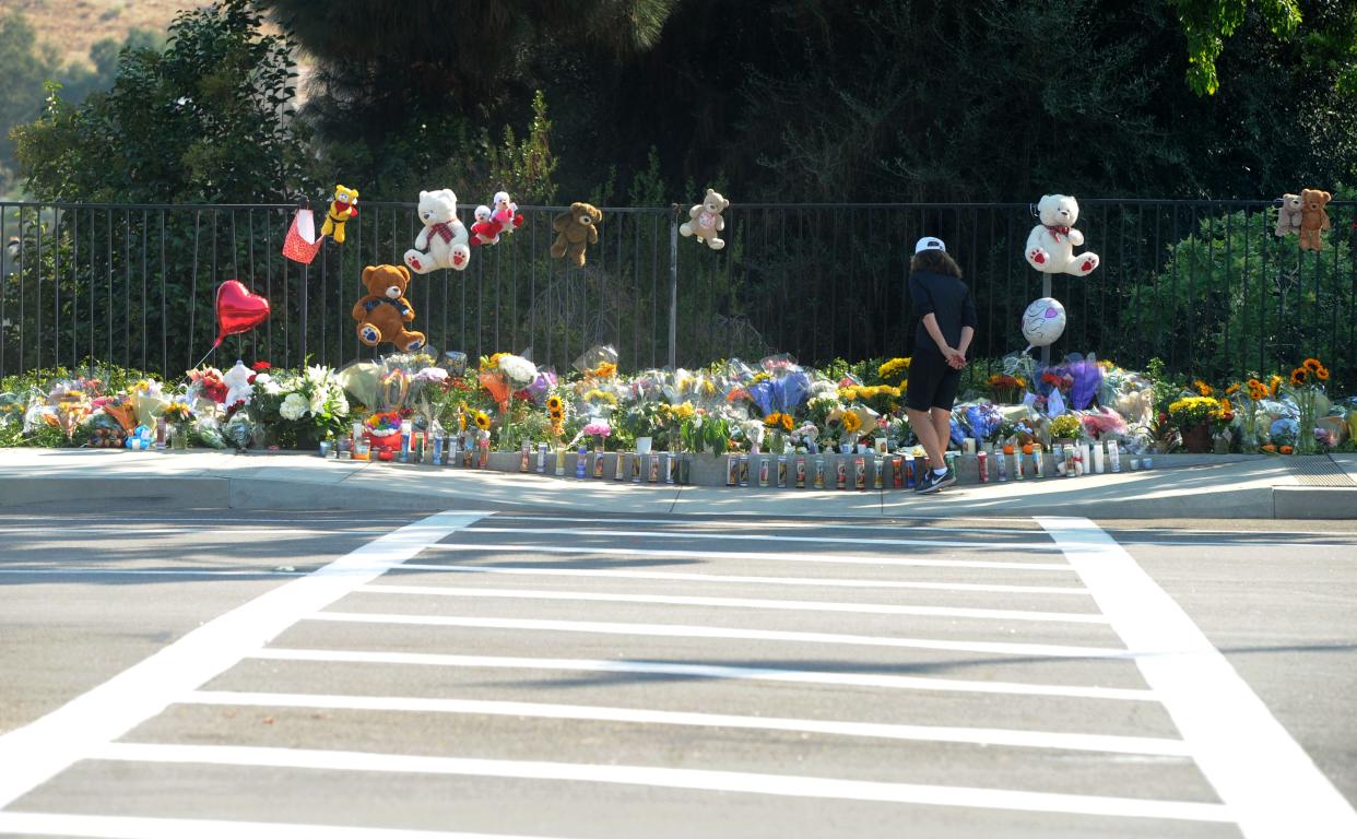 Days after a fatal crash, flowers and stuffed animals filled a roadside memorial for Mark and Jacob Iskander. The brothers were struck and killed on Sept. 29, 2020.