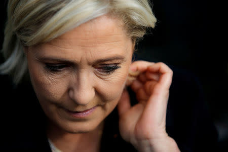 FILE PHOTO - Marine Le Pen, French National Front (FN) political party leader and candidate for French 2017 presidential election, reacts after a visit to a market in Concarneau, France, March 31, 2017. REUTERS/Stephane Mahe/File Photo