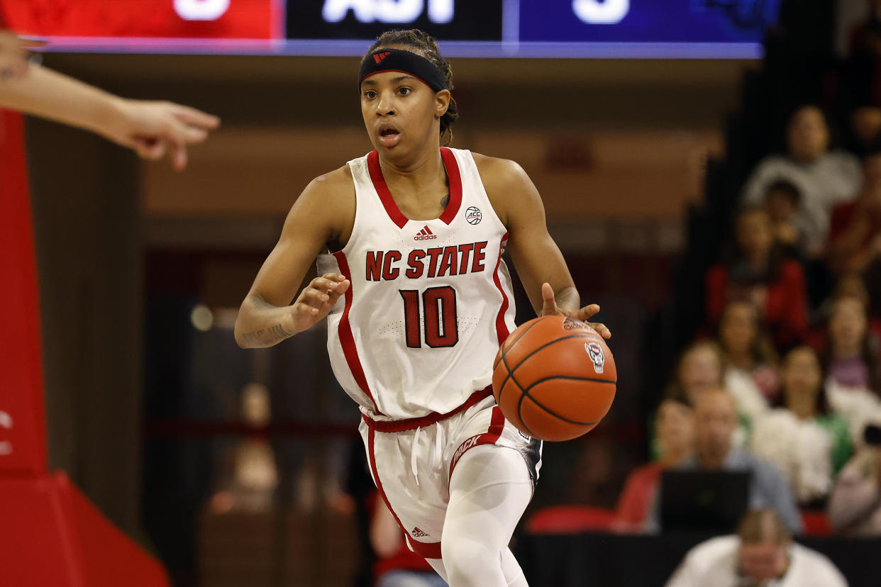NC State's Aziaha James brings the ball up the court against Liberty on Dec. 10, 2023, in Raleigh, North Carolina. (AP Photo/Karl B. DeBlaker)