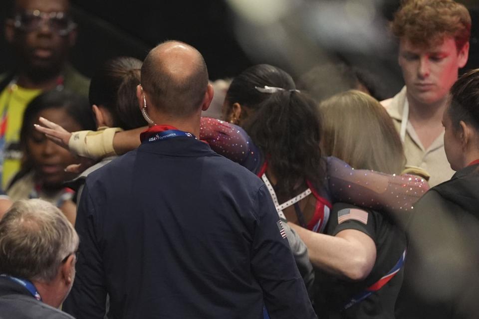 Shilese Jones is helped off the mat after an injury during warms up before the start of the United States Gymnastics Olympic Trials on Friday, June 28, 2024 in Minneapolis. (AP Photo/Abbie Parr)