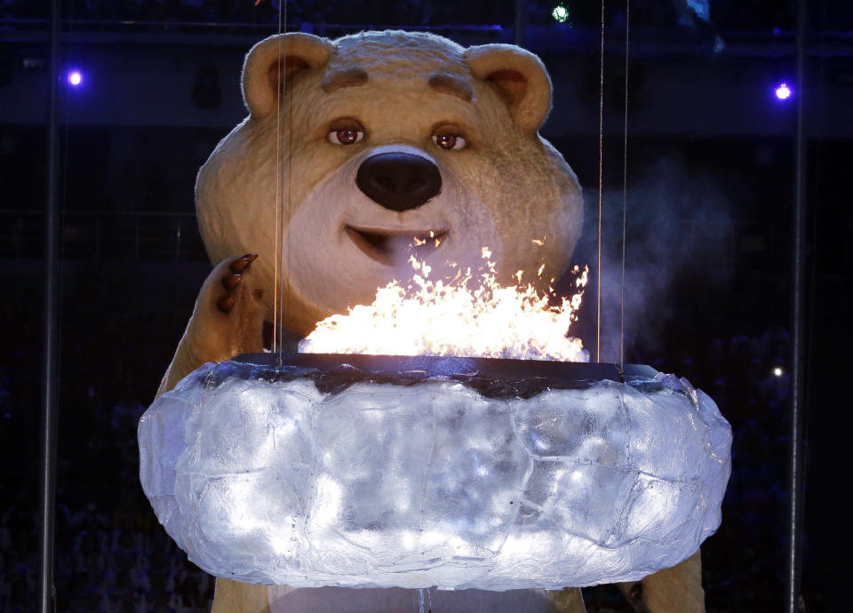 A large mascot blows out the Olympic flame with his breath during the closing ceremony of the 2014 Winter Olympics, Sunday, Feb. 23, 2014, in Sochi, Russia. (AP Photo/Charlie Riedel)