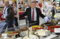 Roland Chassain, right-wing UMP candidate for Bouches-du-Rhone campaigns in a market in Saint-Martin-de-Crau, southern France